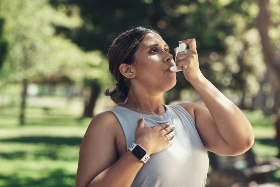 Woman using inhaler