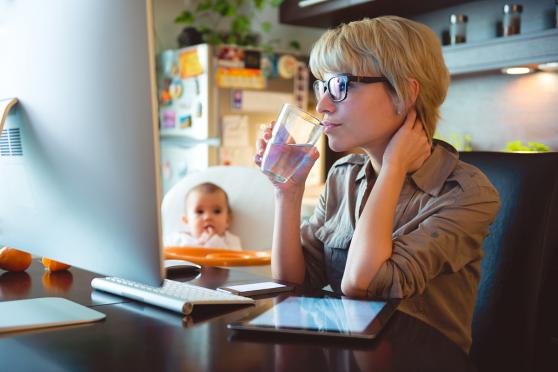 Woman using the computer to estimate health care costs